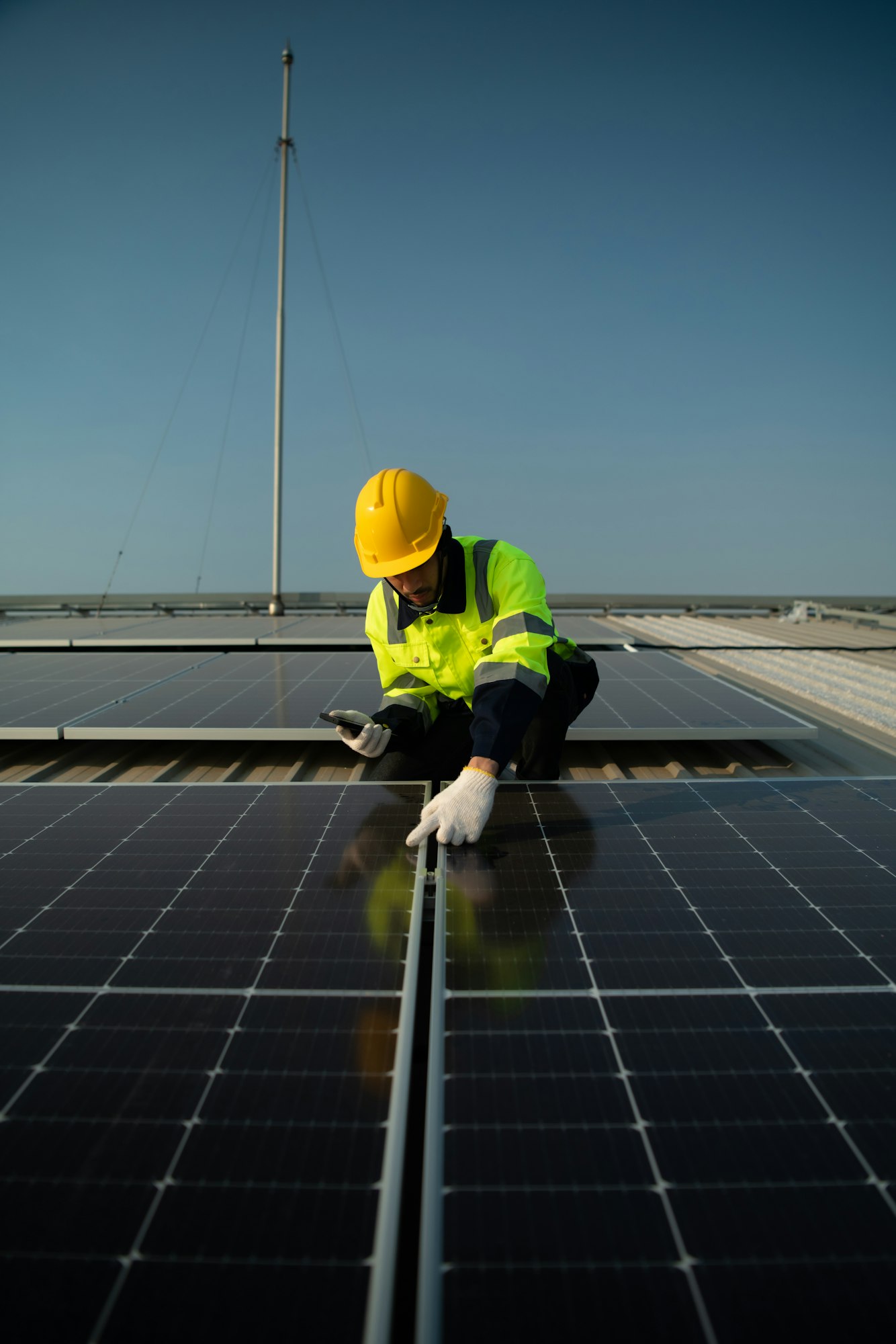 Technicians provide quarterly solar cell maintenance services on the factory roof